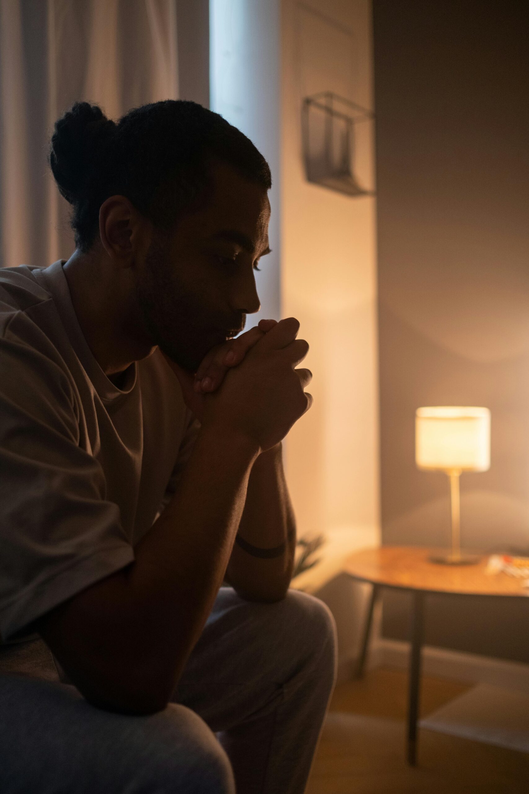 Thoughtful man in the evening light, evoking solitude and introspection.
